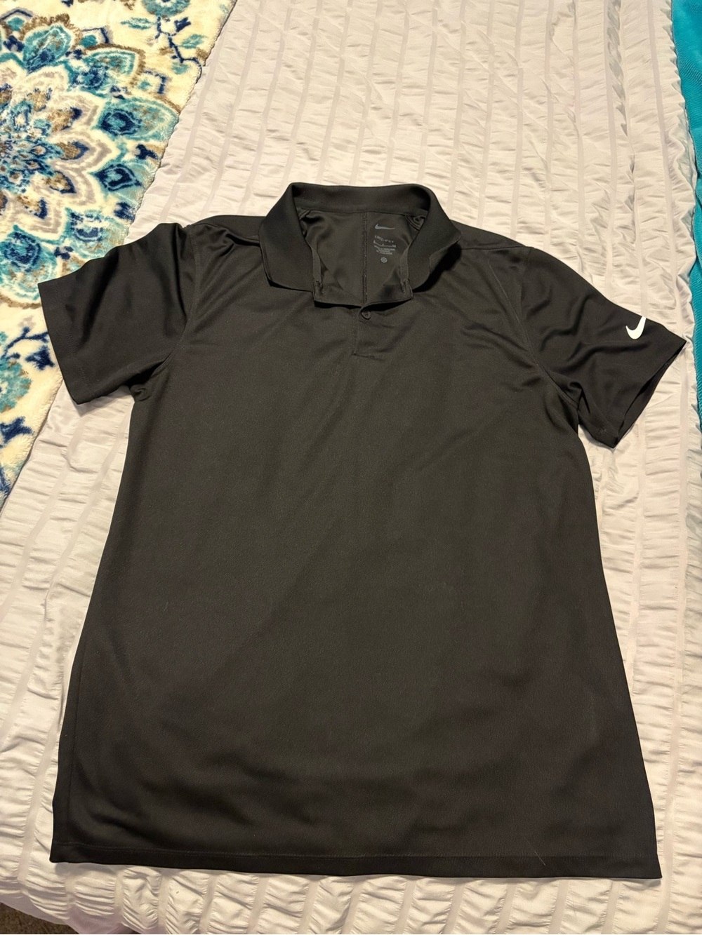 Men’s black Nike polo